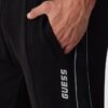 GUESS Czarne męskie spodnie dresowe z lampasami Mickey