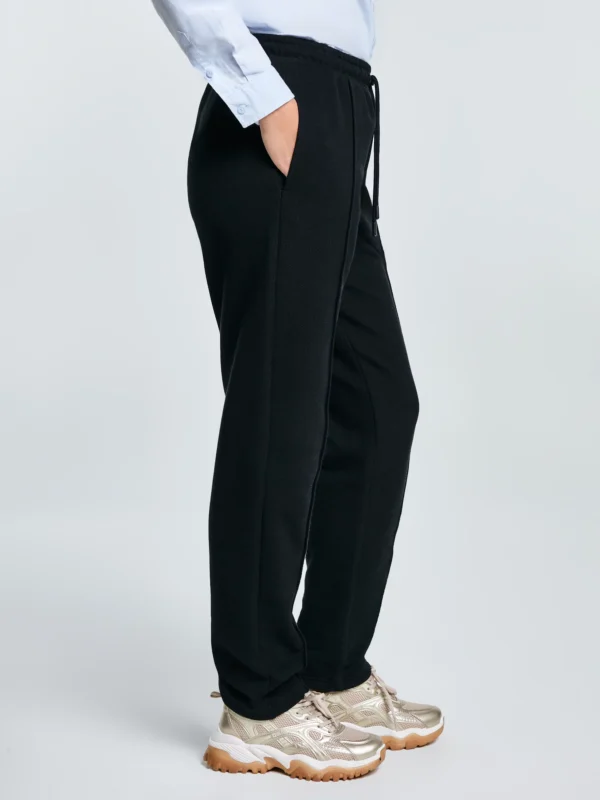 14ccb2fd736f9f9d79b897f11a4606d76ab4e0a6 Spodnie damskie dresowe z przeszyciem czarne Pixelinap 906