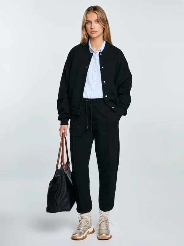 2c34523605d0f615840d4e82b062ae4faf34442c Spodnie damskie dresowe z przeszyciem czarne Pixelinap 906