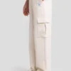 Spodnie dziewczęce dresowe cargo kremowe Naomap 103