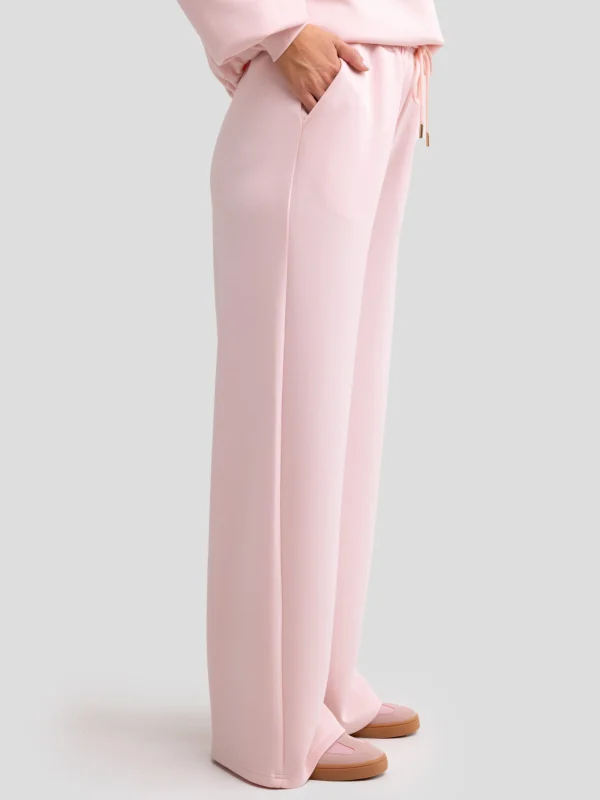 a6e29d1d3d729257411f2643bddd2b583411a429 Spodnie damskie dresowe z szeroką nogawką jasnoróżowe Lunarap 600