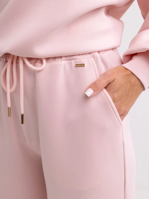 c5ad66488642206d8bcfd3604ec86f629aa1f79a Spodnie damskie dresowe z szeroką nogawką jasnoróżowe Lunarap 600