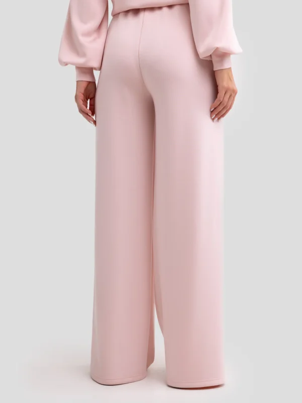 cda5f8eed61f5630447dcba59c04a37a8e1d5714 Spodnie damskie dresowe z szeroką nogawką jasnoróżowe Lunarap 600