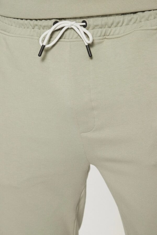 GUESS Zielone męskie spodnie dresowe z lampasami New Arlo