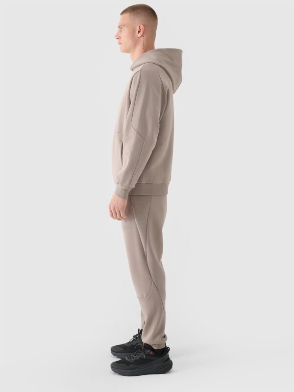 4F Spodnie dresowe joggery męskie 4F x Robert Lewandowski - beżowe