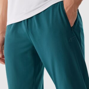 4F Spodnie treningowe szybkoschnące męskie - turkusowy