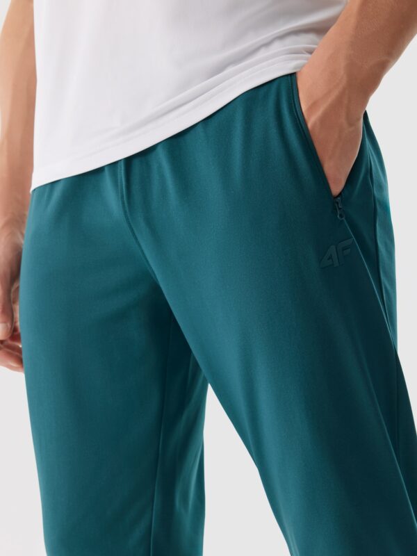 25ef5de89c4714e5196f7fc761f1d0166d7806e6 4F Spodnie treningowe szybkoschnące męskie - turkusowy