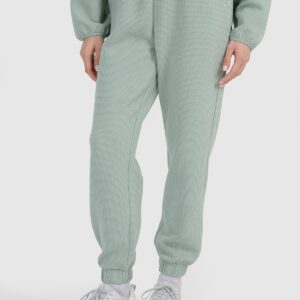 4F Spodnie dresowe z waflowej dzianiny damskie - turkusowe