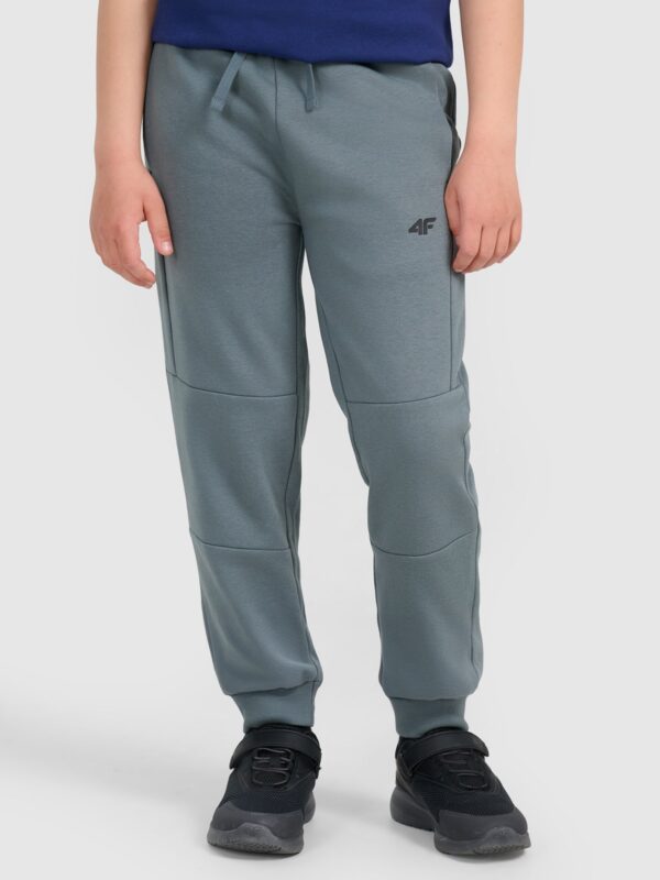 98575be4b90c2cbfa0999e777cf2b332443bd9e7 4F Spodnie dresowe joggery chłopięce - turkusowe 164 (13-14 lat)