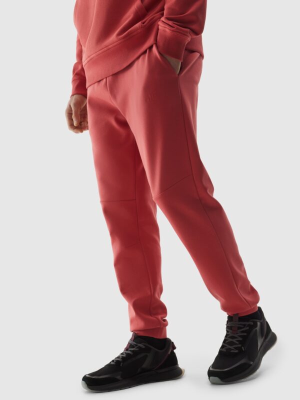 4F Spodnie dresowe joggery męskie - różowe