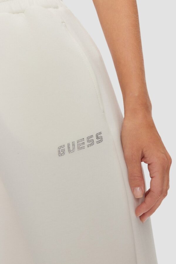 GUESS Dresowe damskie spodnie w kolorze ecru Cecilia Scuba