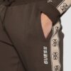 GUESS Brązowe męskie spodnie dresowe z lampasami Mickey