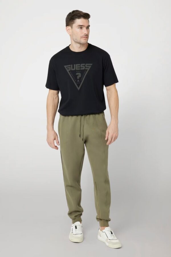 GUESS Zielone męskie spodnie dresowe z lampasami Mickey